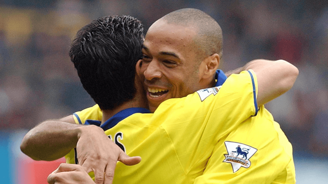 Thierry Henry and Jose Antonio Reyes celebrate the winner against Fulham